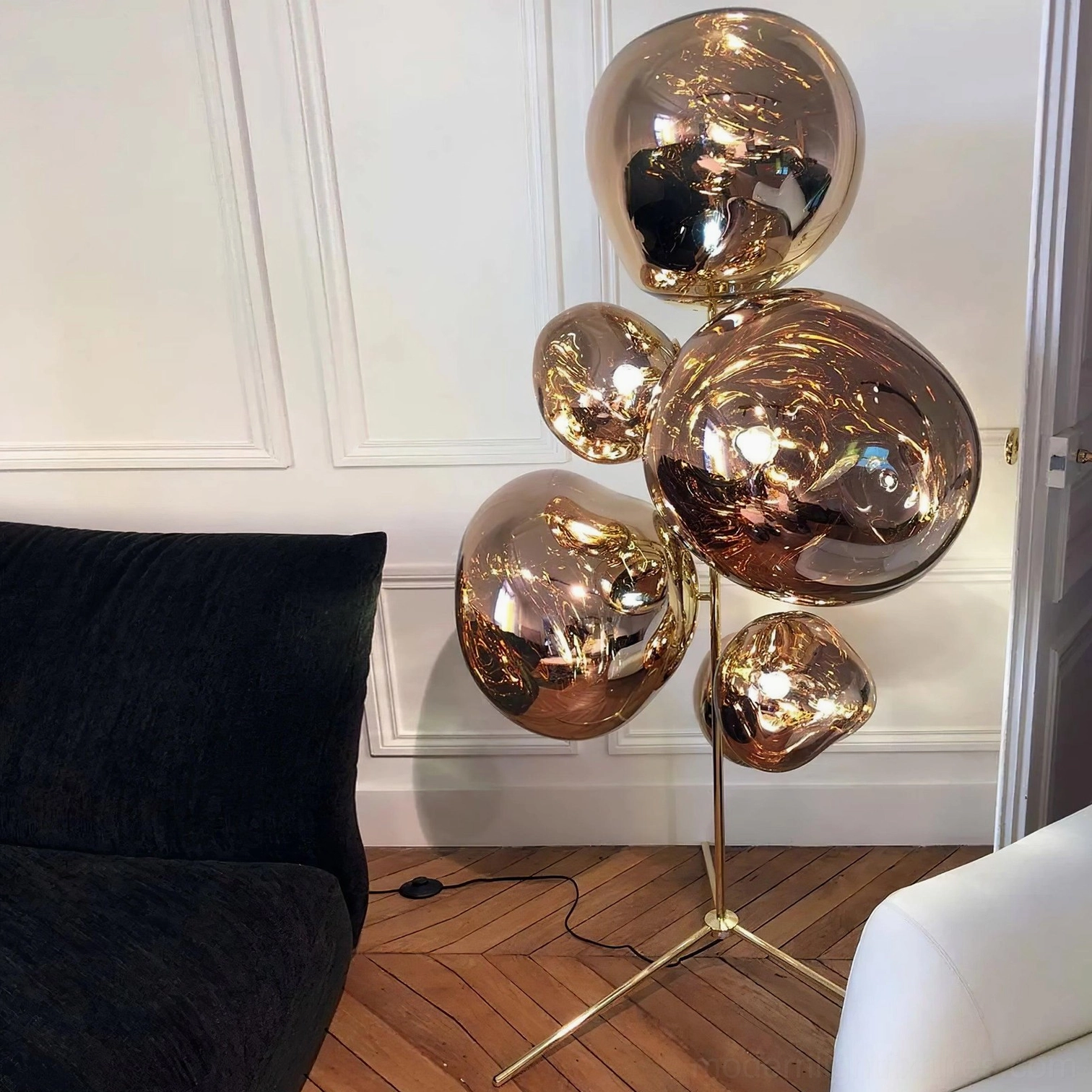 Gold bubble floor lamp with polished bronze glass shades in elegant paneled living room