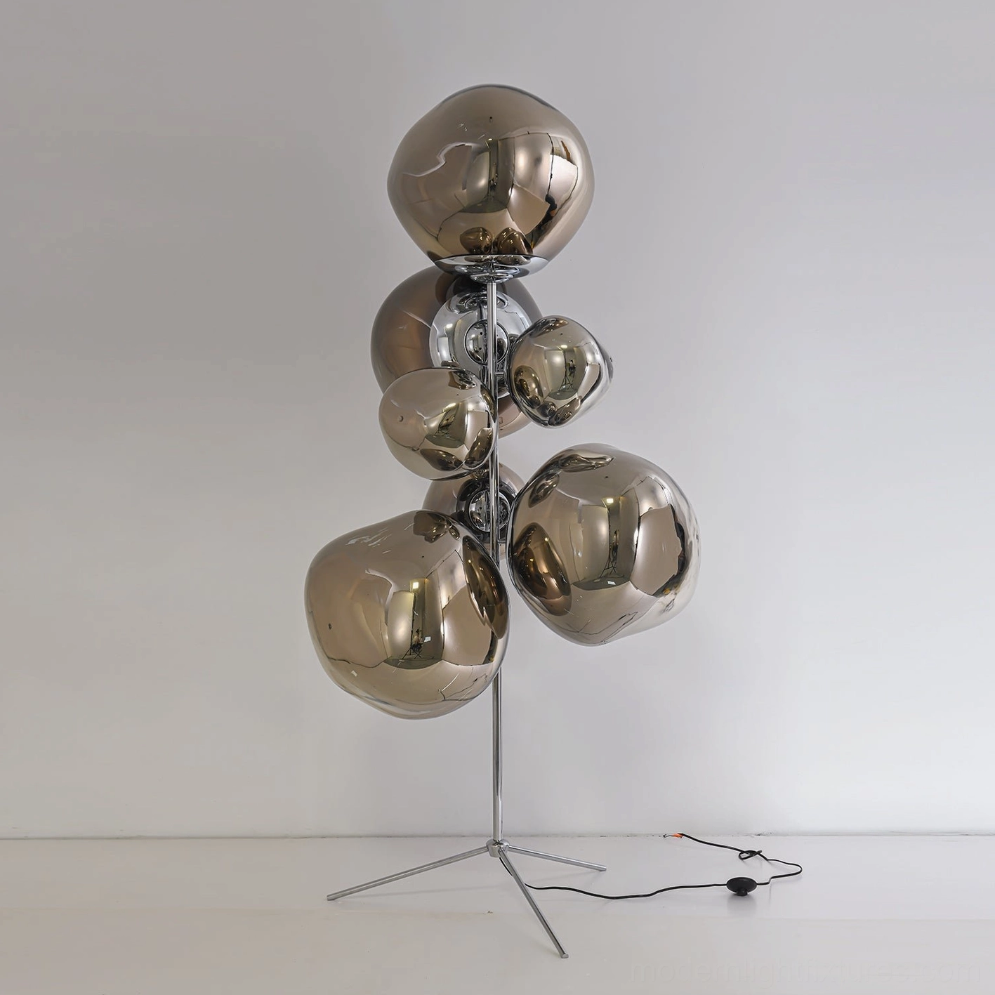 Large modern bubble floor lamp creating ambient illumination in spacious room setting