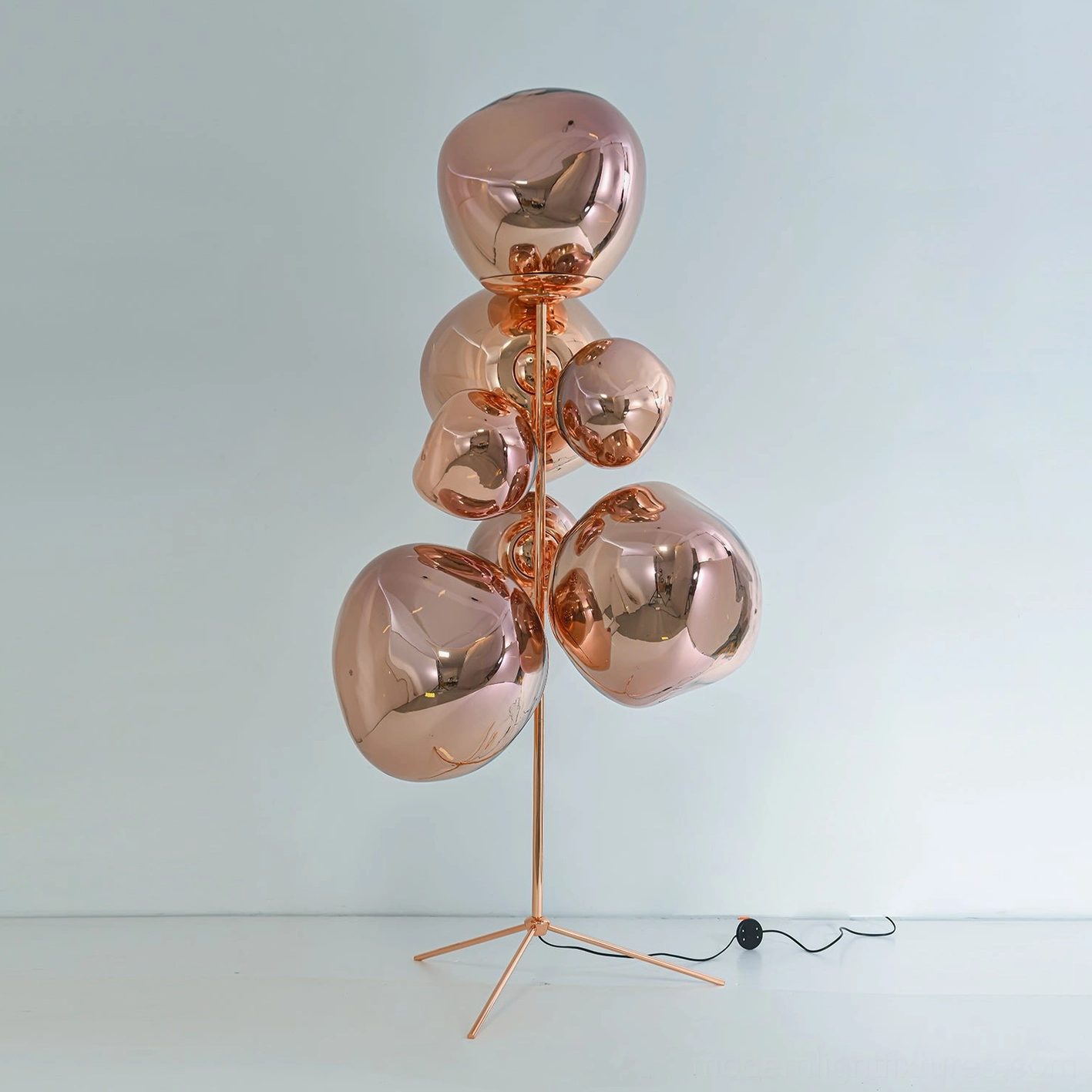Lava bubble floor lamp large size with metallic finish beside furniture for scale