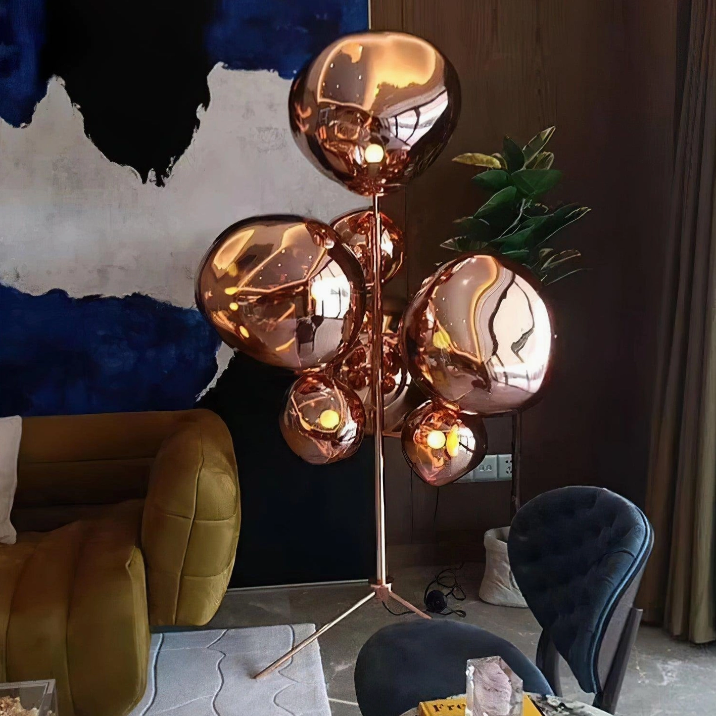 Lava bubble floor lamp side profile view showing tripod base and asymmetrical shade arrangement
