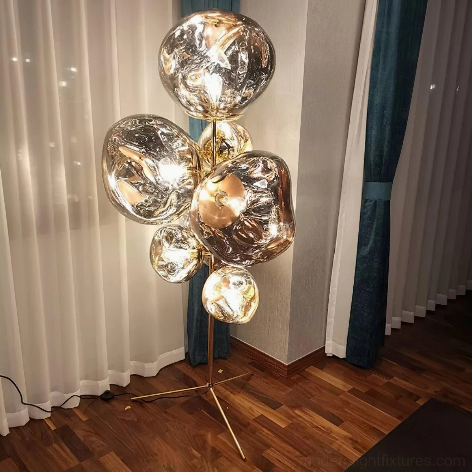 Silver chrome bubble floor lamp in narrow hallway with space-saving modern design