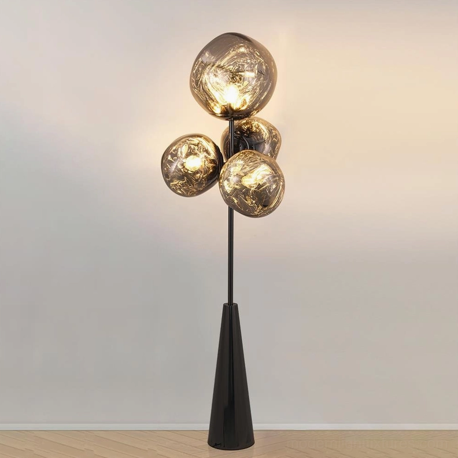 Lava glass ball floor lamp with black hardware and smoked brown glass against white wall - modern luxury style