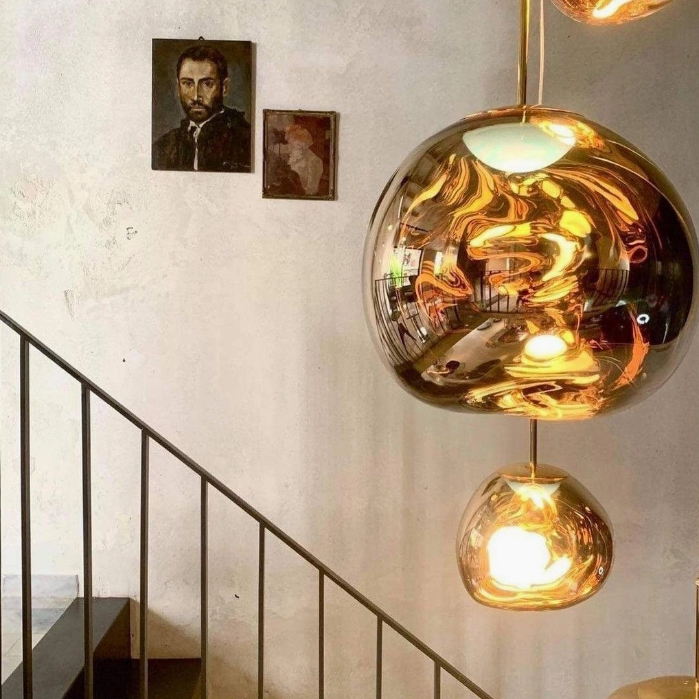 Contemporary pendant shade distorted metallic finish atmospheric lighting design