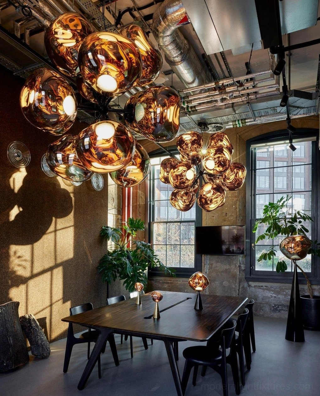 Contemporary pendant light creating atmospheric fractured ceiling patterns