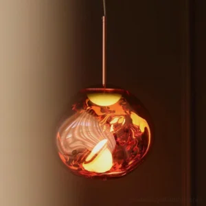 Amber-toned lava pendant lamp casting fractured light in warm interior space