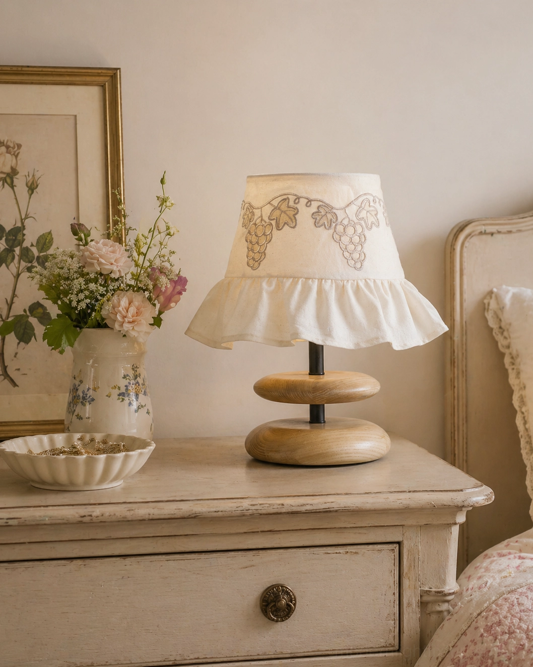 Lavelle cottage style table lamp on bedroom nightstand with botanical vase and vintage decor