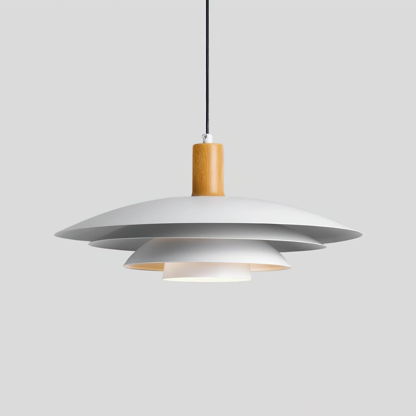 Stratalite layered metal disc pendant light front three-quarter view, exposed shade layers with wood top finish detail