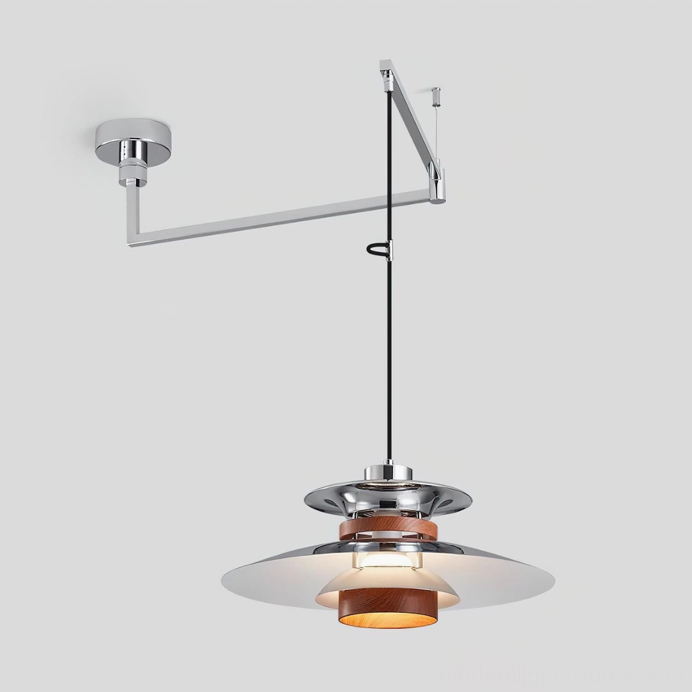 Layered metal pendant shade with walnut wood accent, studio product photography