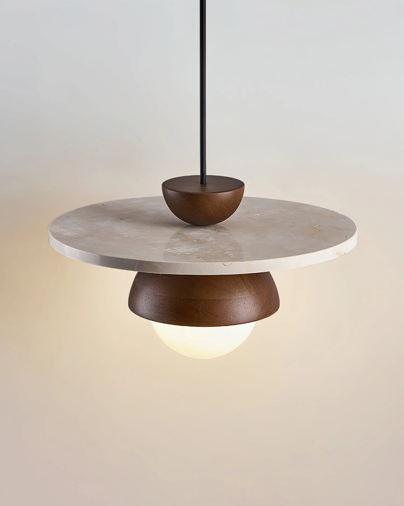 Contemporary pendant light fixture with symmetrical layered design and glowing frosted glass sphere