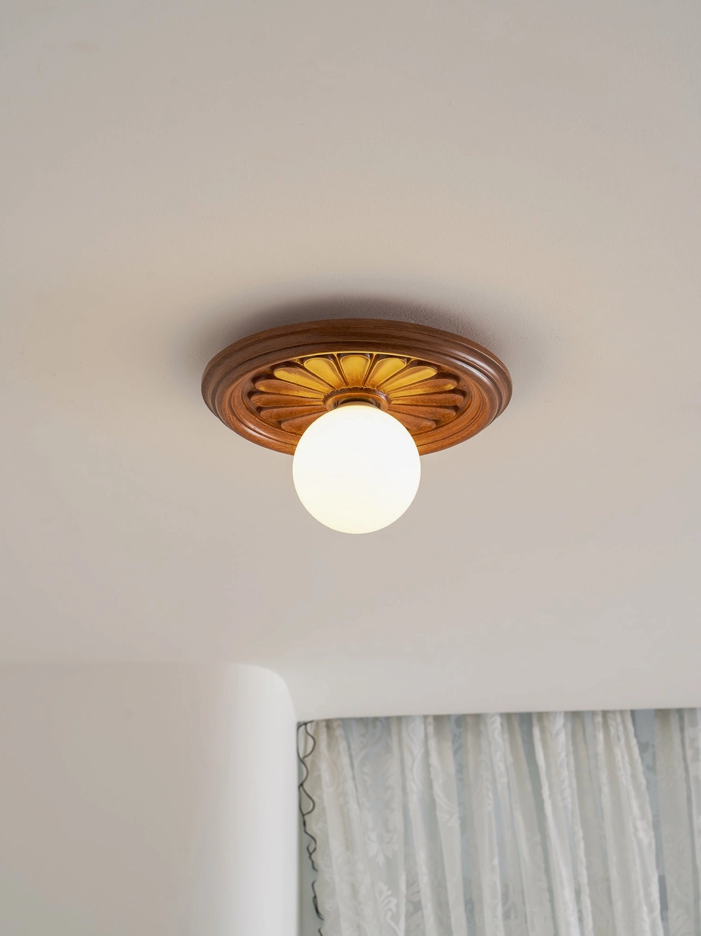 Multiple modern resin ceiling lights creating layered lighting zones in open living space