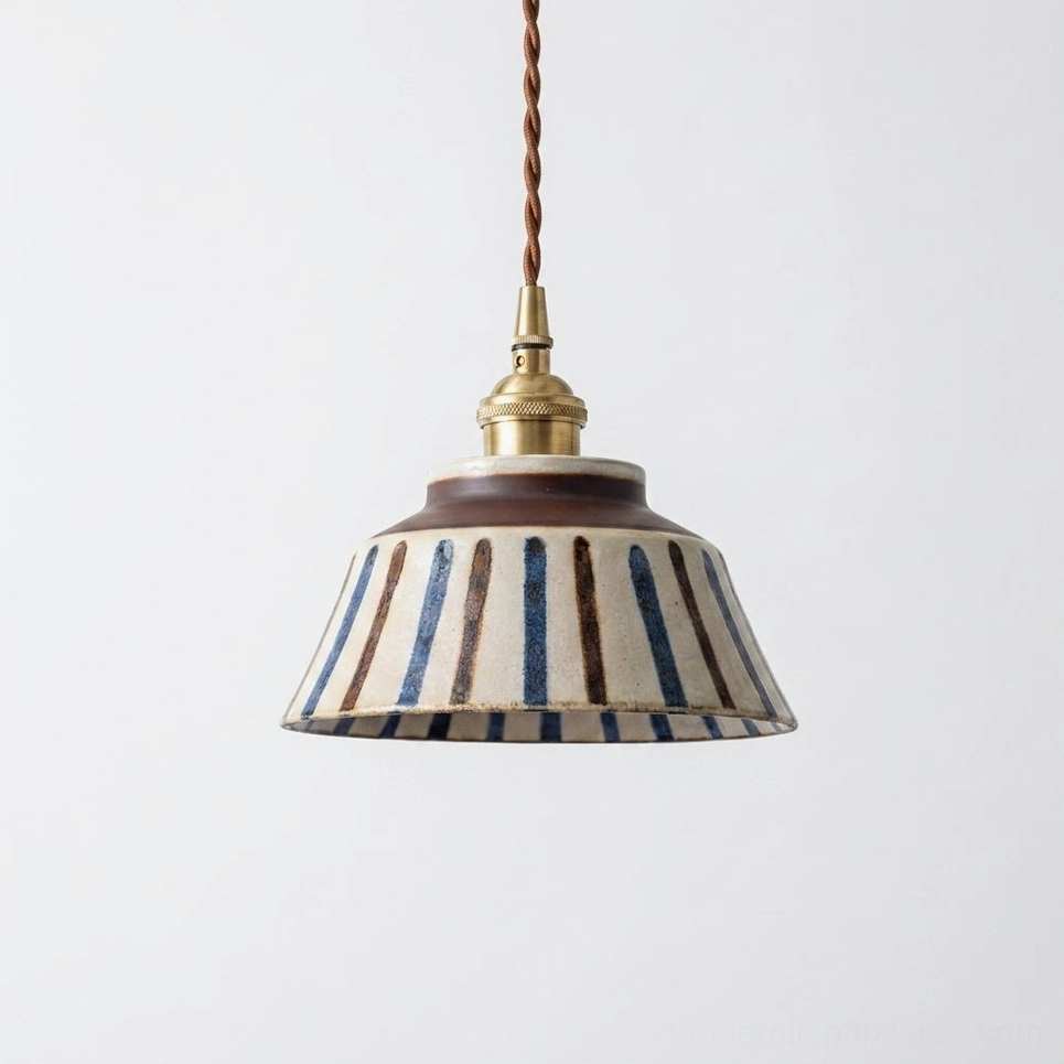 Hand-painted ceramic pendant lamp with leaf vine pattern on cream stoneware, indigo glaze, brass hardware and twisted cord