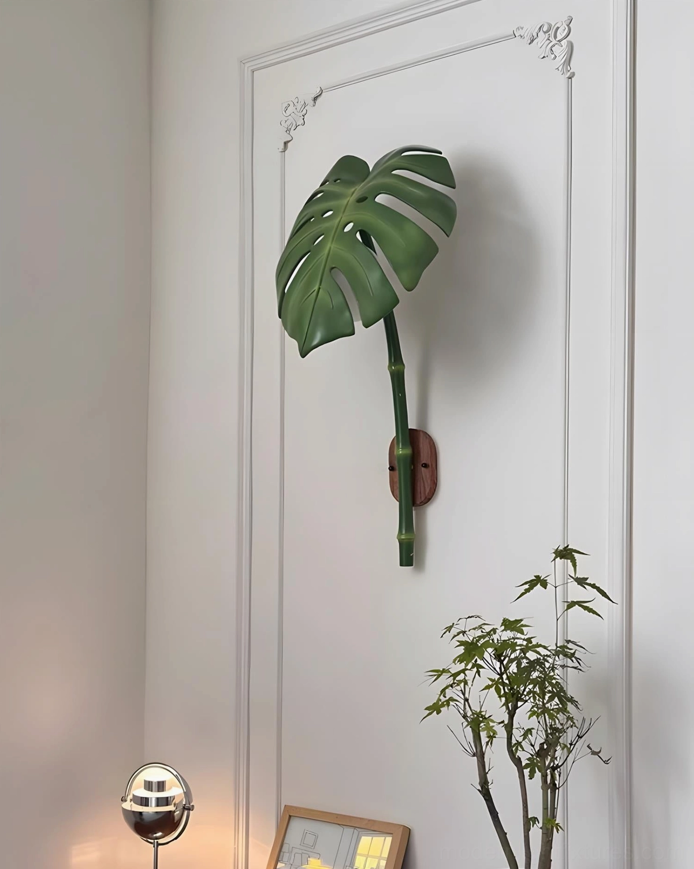 Leaf-shaped wall sconce complementing eclectic maximalist interior design with patterned textiles