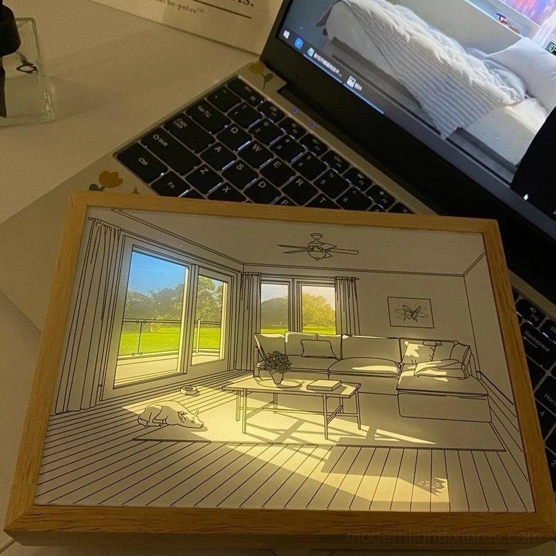 Living room workspace with warm LED art painting light on desktop decoration