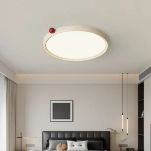 Slim LED ceiling light fixture installed in contemporary bedroom with black bed and minimalist décor