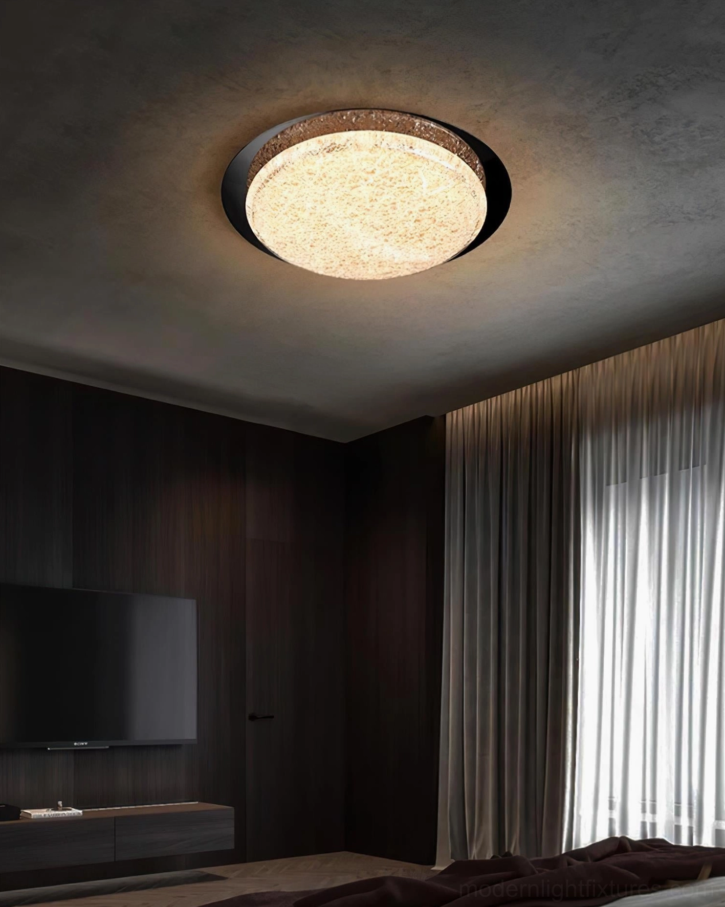 Slim profile LED ceiling light with black base mounted on dark wood bedroom ceiling - architectural detail