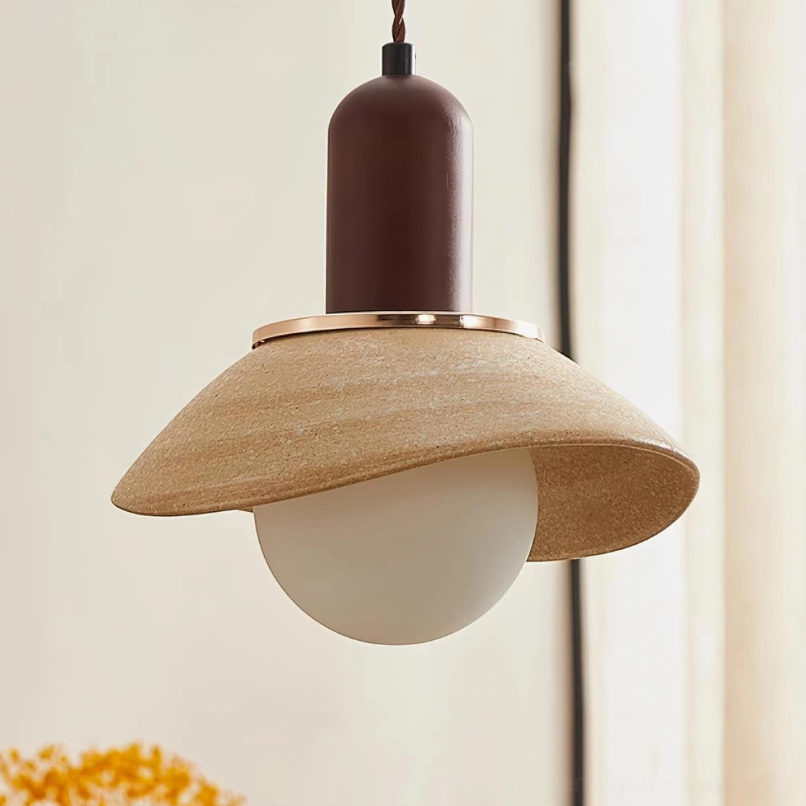 Close-up front view of Legro pendant light with frosted bulb, rough wood-textured ceramic shade and gold metal trim