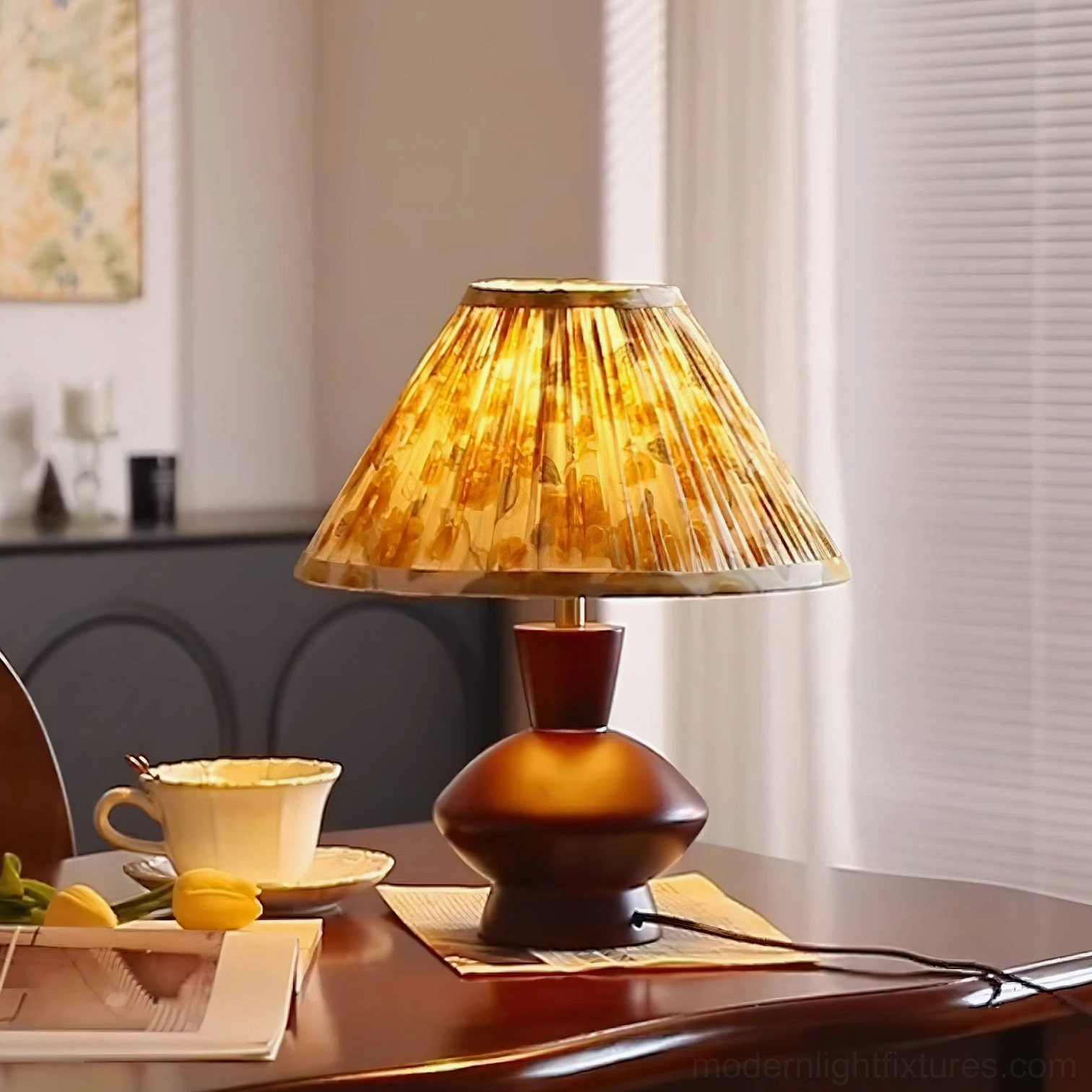 Lenora table lamp close-up detail showing yellow floral pleated fabric shade and walnut base construction