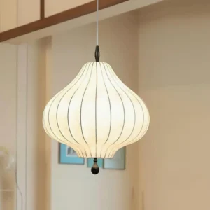 Leocadia white striped pendant light illuminated in contemporary living room, warm glow from fabric shade