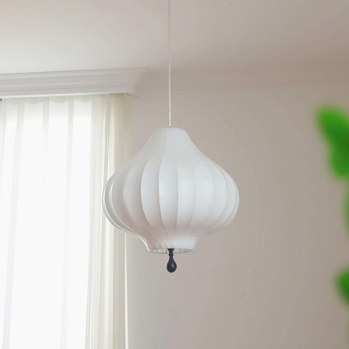 Leocadia modern pendant light in natural daylight, side view showing pure white striped shade texture