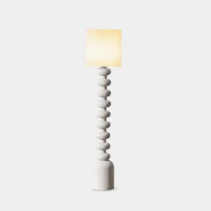 Leona modern textured floor lamp with speckled resin bubble base and cylindrical white drum shade, front view on studio background