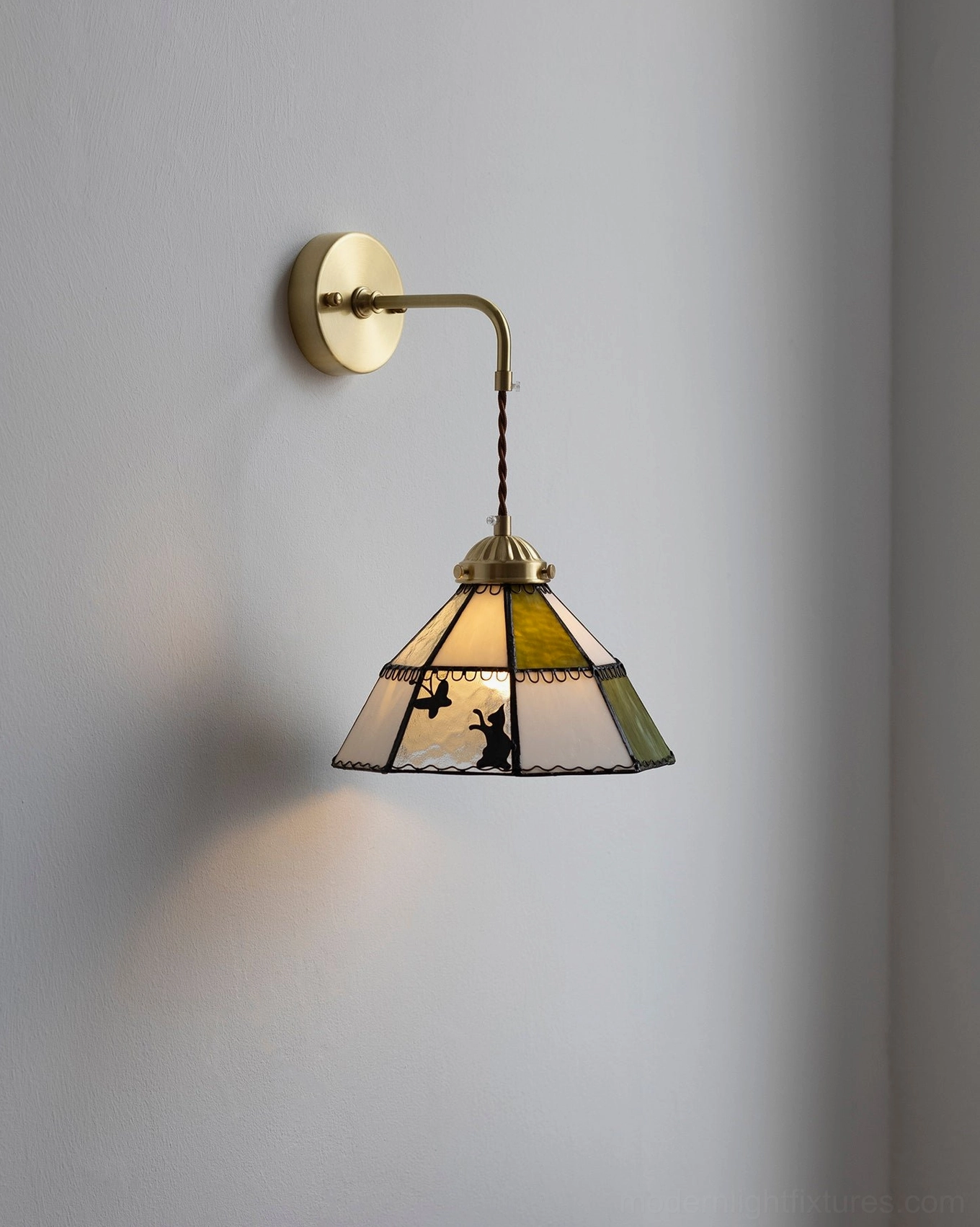 Right-side view of illuminated rabbit motif stained glass wall lamp
