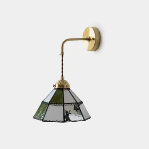 Leporine stained glass wall sconce frontal view with brass mount and rabbit silhouette design