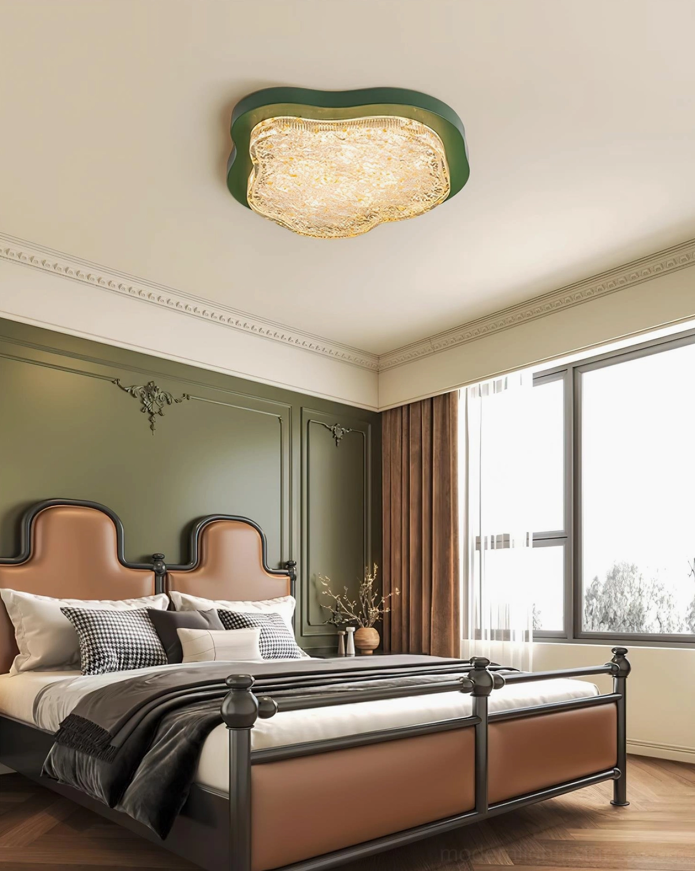 Levante modern ceiling light installed above leather bed with crown molding and green accent wall in luxury bedroom