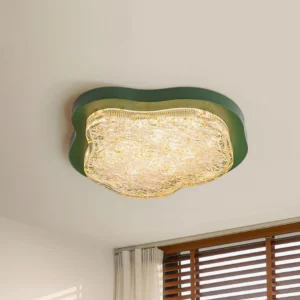 Green Levante modern ceiling light installed overhead in minimalist bedroom with wooden louver windows