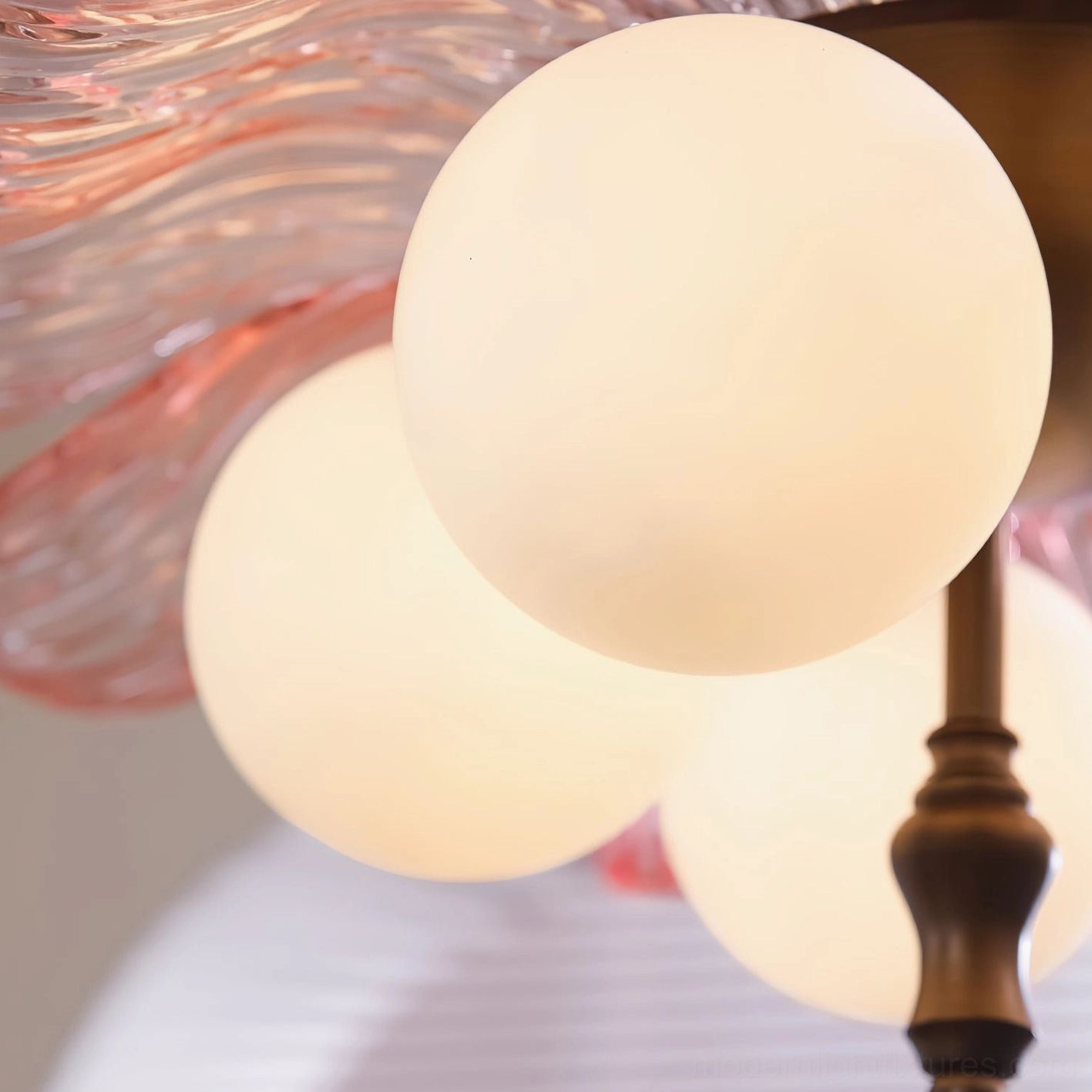 Levara ceiling light showing botanical-inspired glass petals with brass hardware details