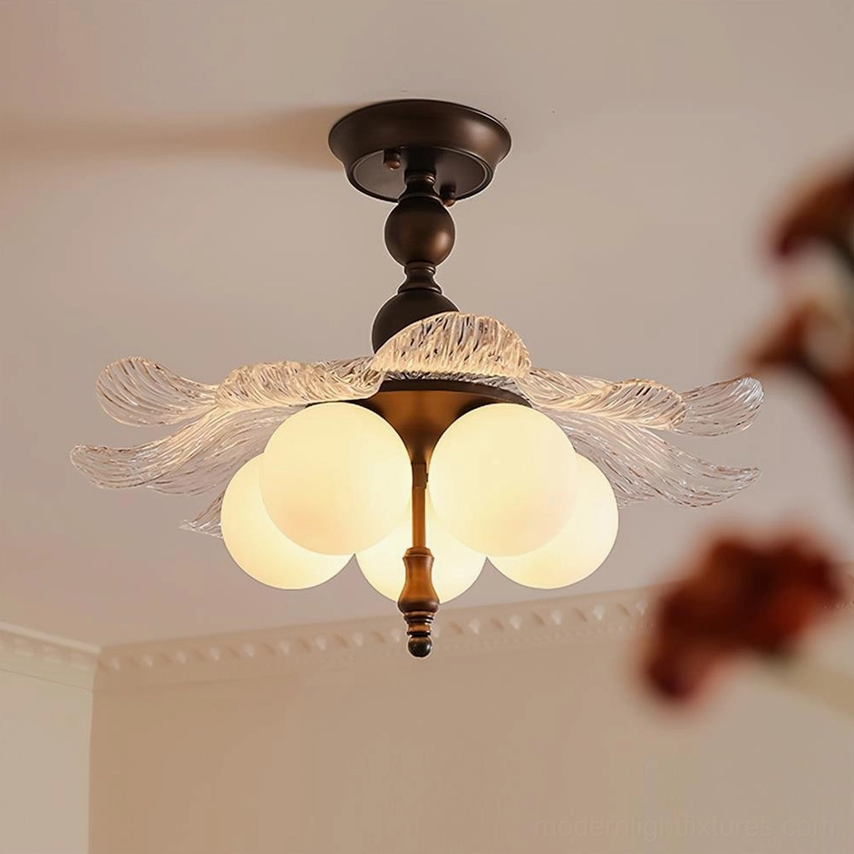 Close-up detail of Levara floral ceiling light brass frame and hand-blown glass petals