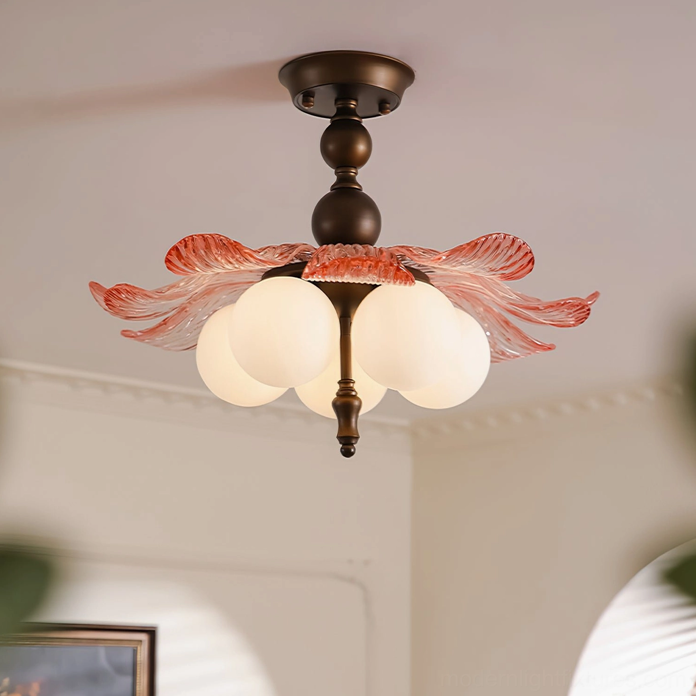 Levara ceiling light fixture with bronze and pink glass petals installed on residential ceiling