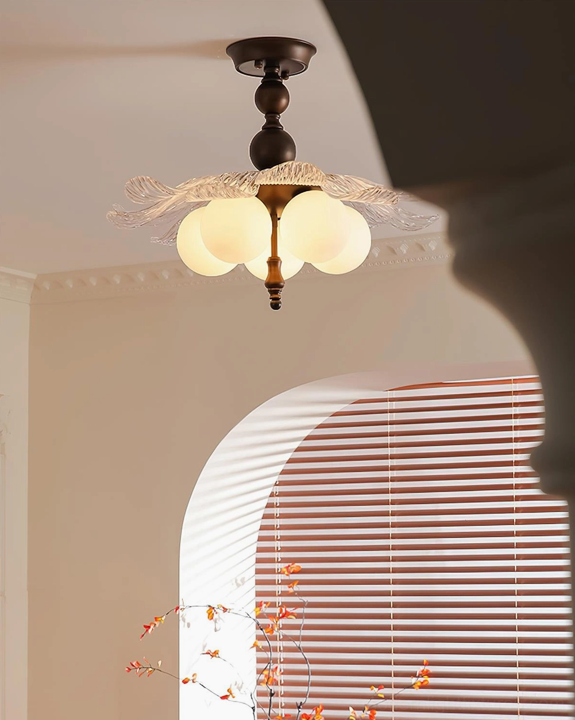 Upward angle view of Levara floral ceiling light showing bronze hardware and frosted bulbs