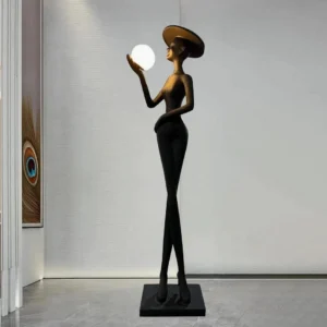 Contemporary Lexa floor lamp in modern hallway setting with glowing white spherical light fixture and minimalist black silhouette