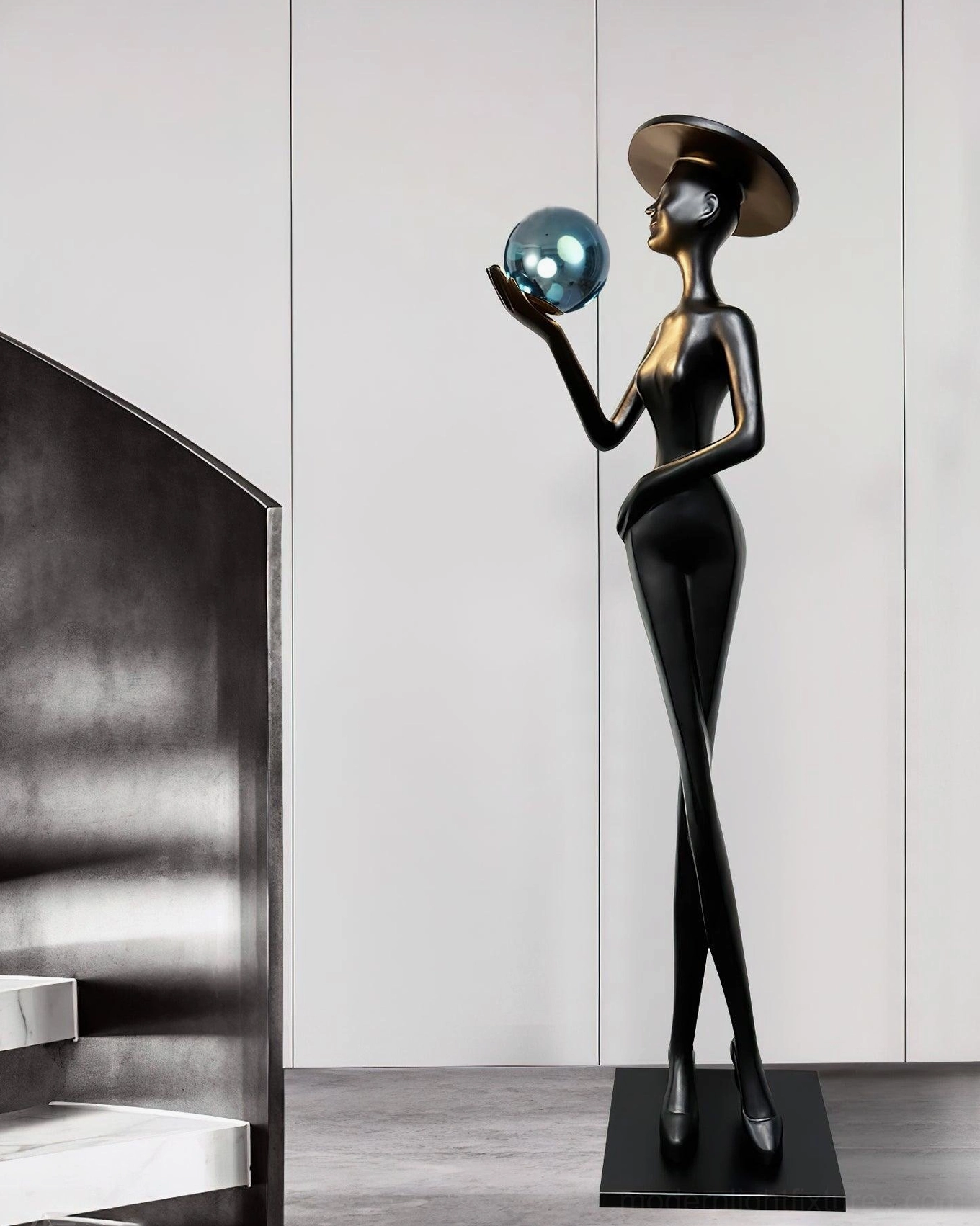 Lexa art floor lamp featuring black silhouette with blue metallic decorative sphere in contemporary stairwell interior