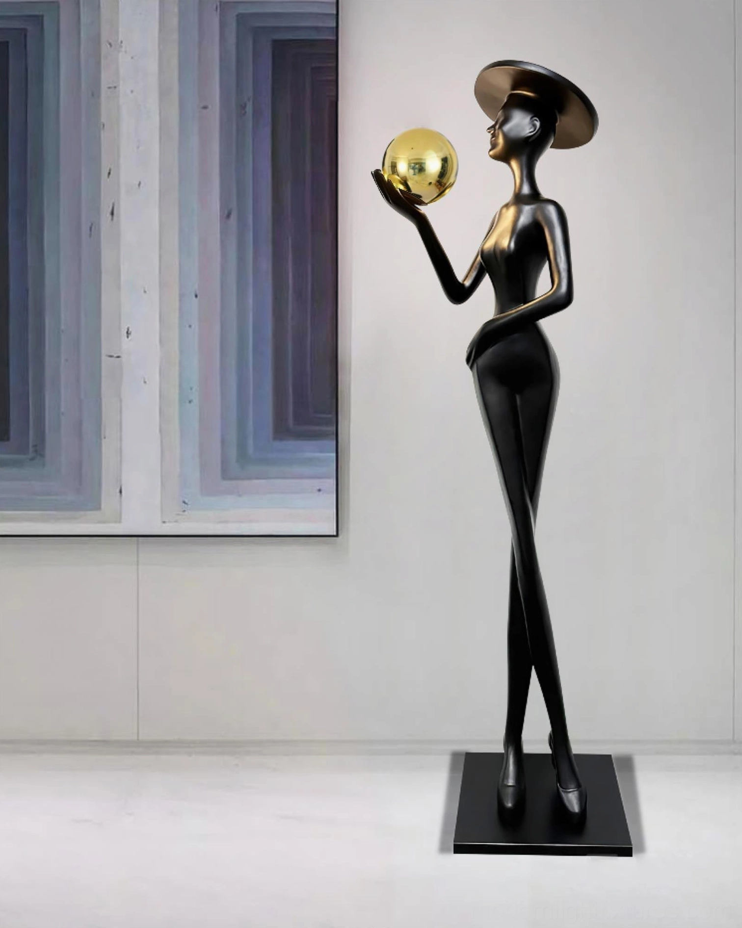 Lexa floor lamp with black body and golden metallic sphere in modern living room with abstract wall art decoration