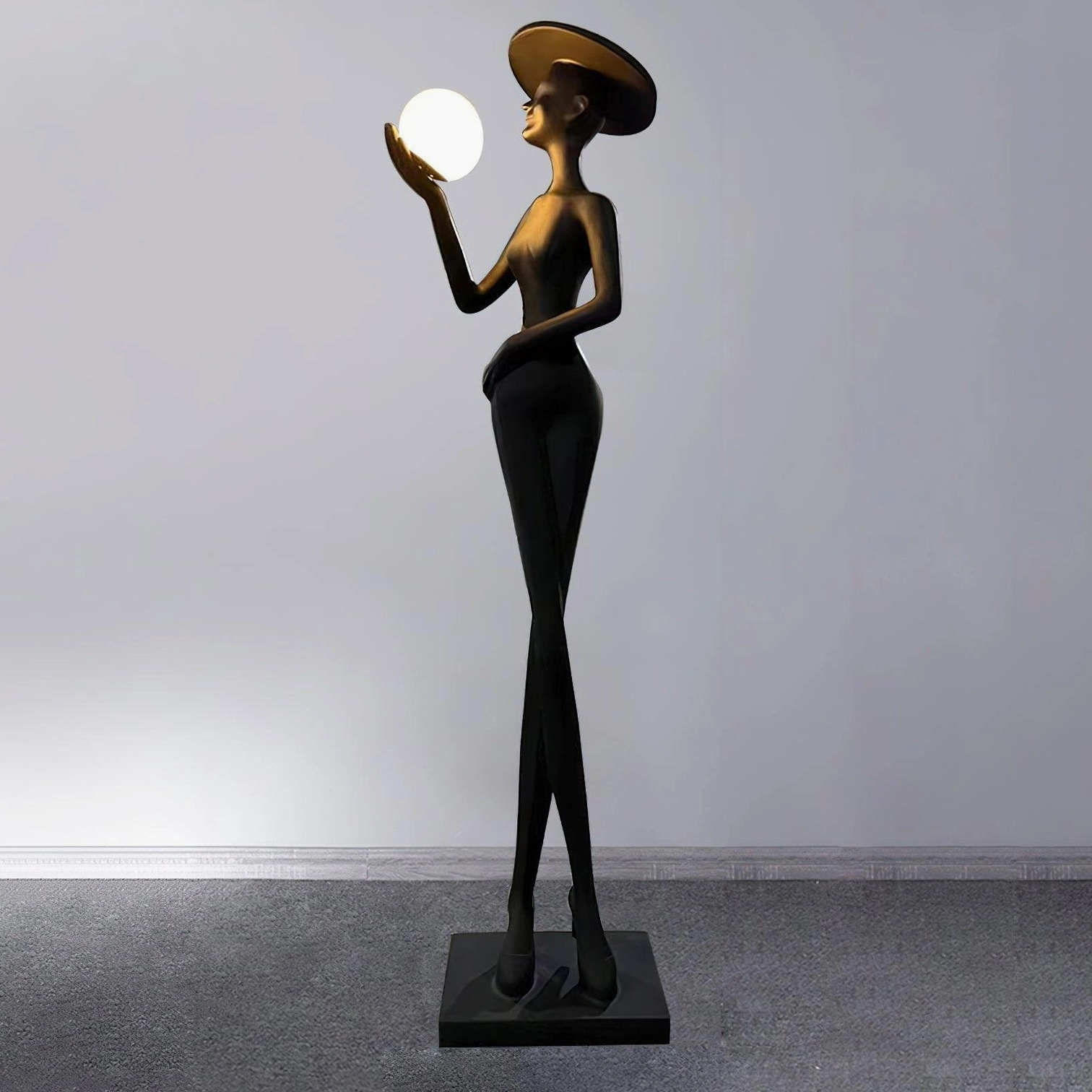 Lexa art sculpture floor lamp right side view showing matte black body with illuminated white sphere on grey carpet minimalist room