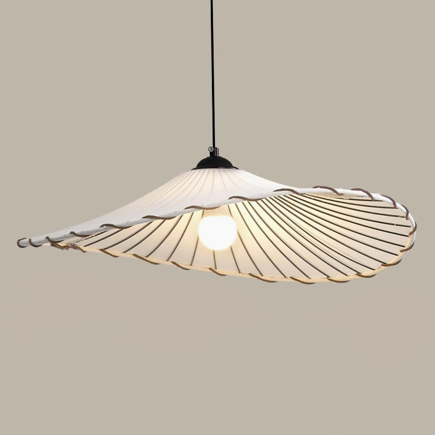 Wabi-sabi style Liana pendant light in bohemian bedroom creating intimate lighting ambiance