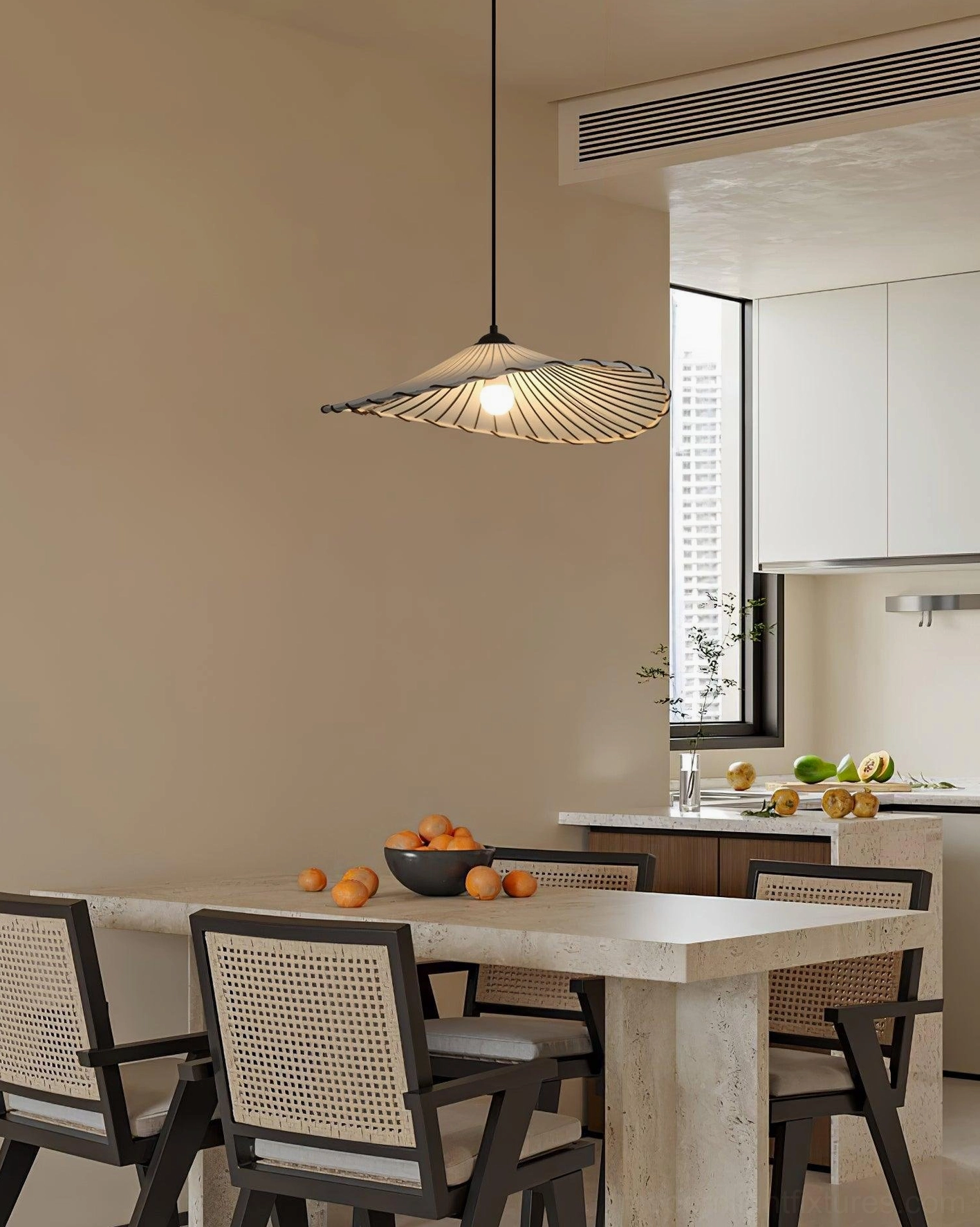 Pleated pendant light Liana casting diffused glow over contemporary dining table setting