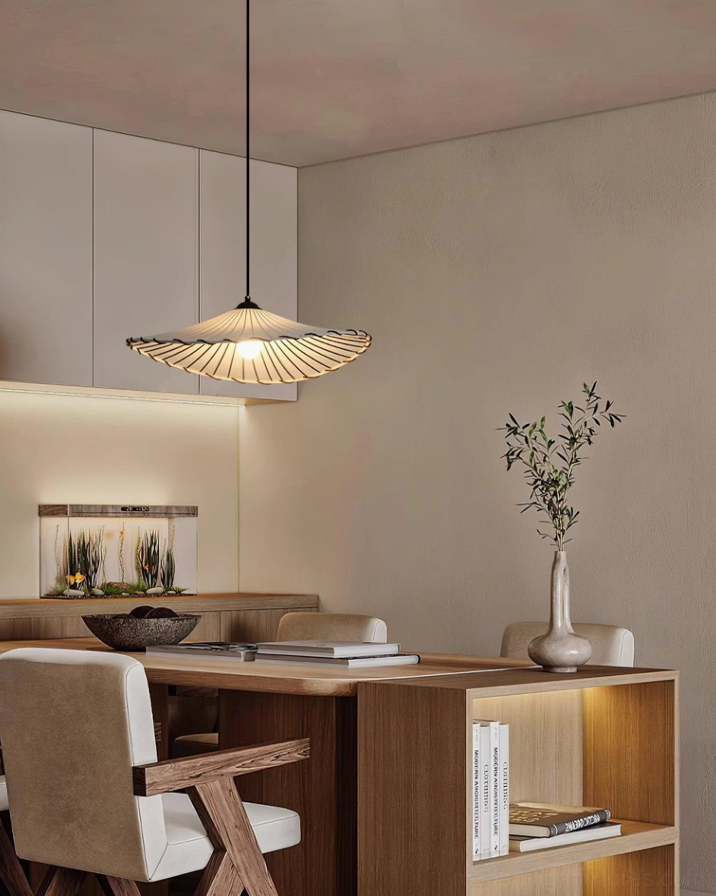 Japanese pleated pendant light Liana above kitchen counter with warm wood and stone surfaces