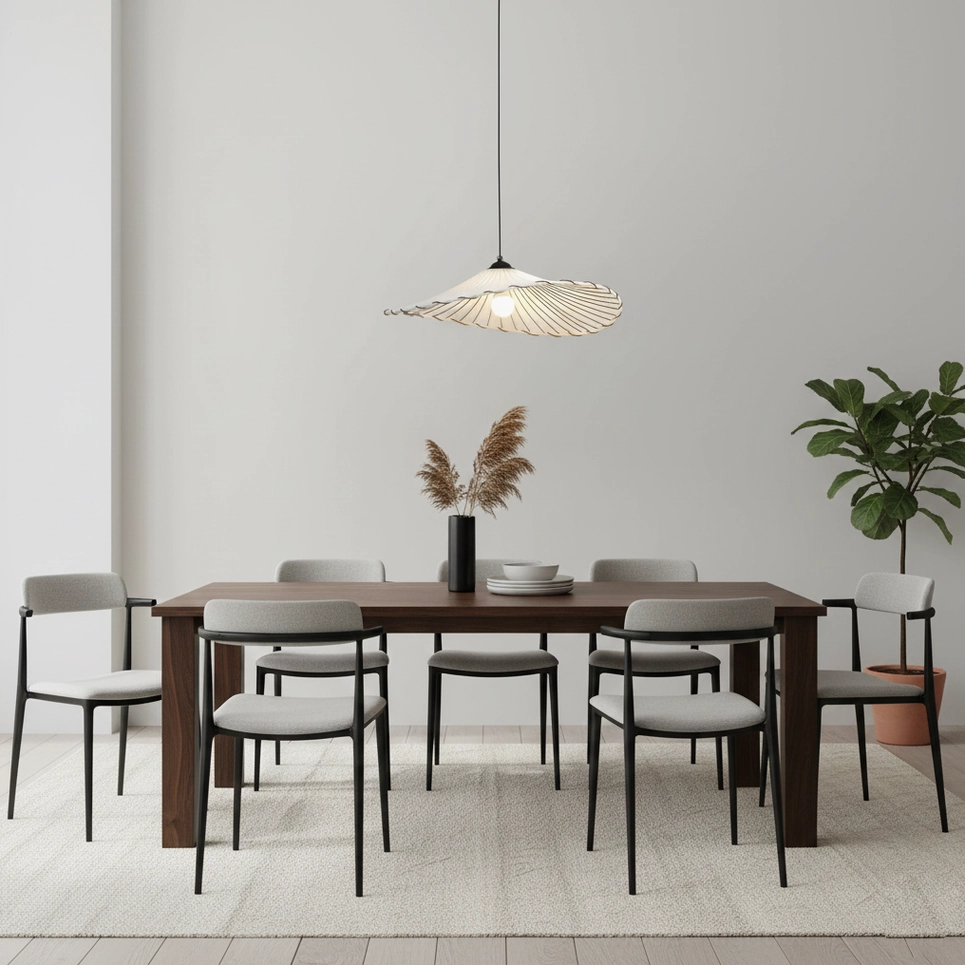 Liana pendant light illuminating modern dining room with dark wood furniture and minimalist design