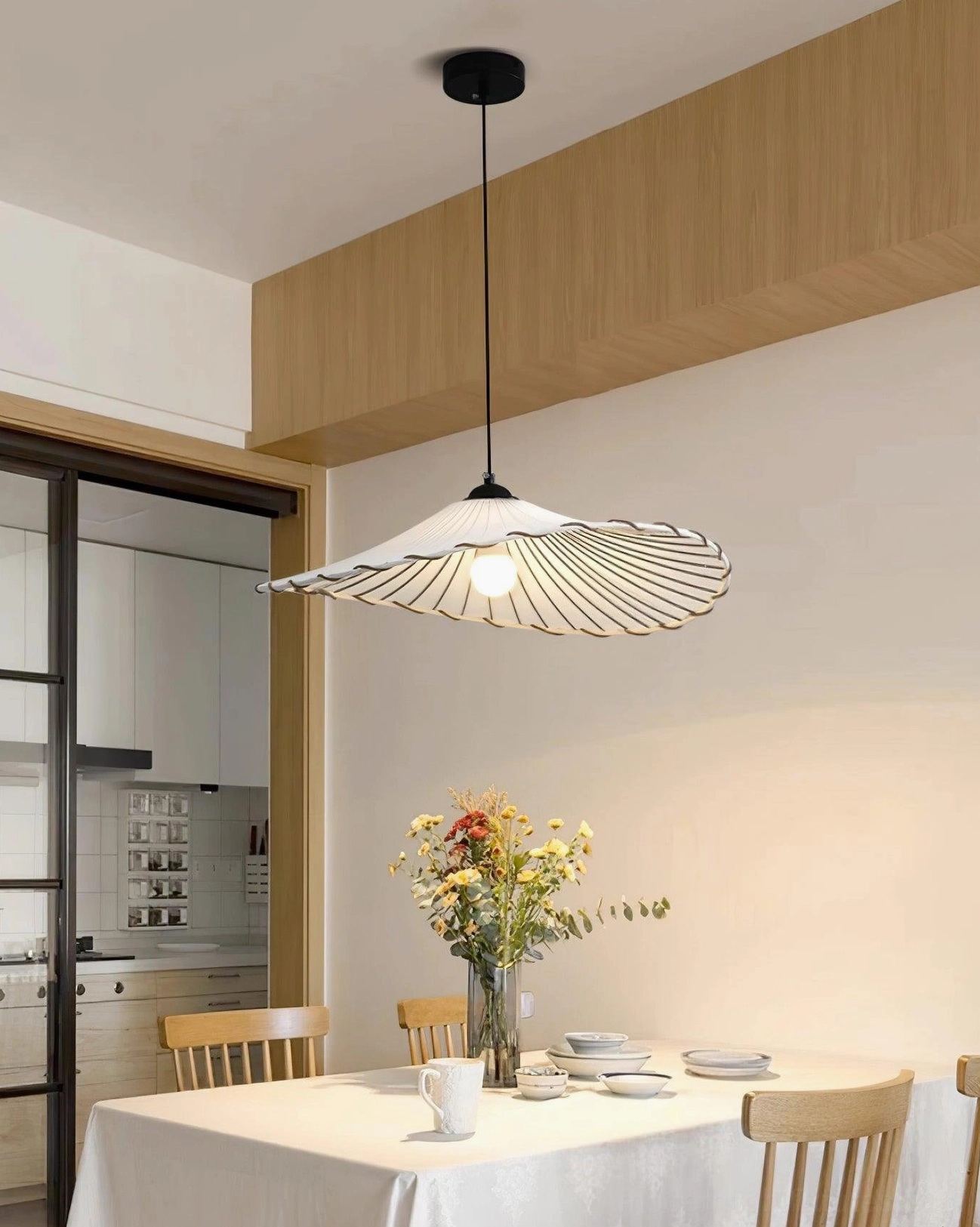 Japanese-inspired Liana pleated pendant lamp in Scandinavian bedroom with minimalist furnishings