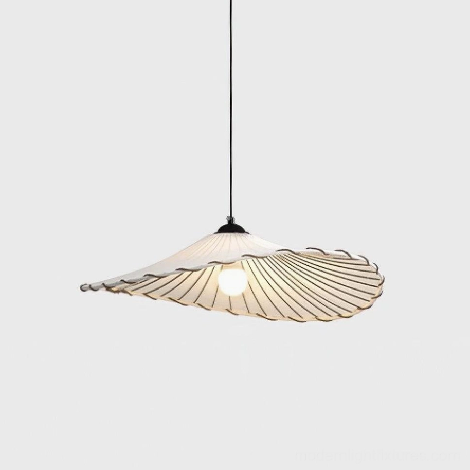 Liana handcrafted pendant light creating warm ambient lighting in cozy living space