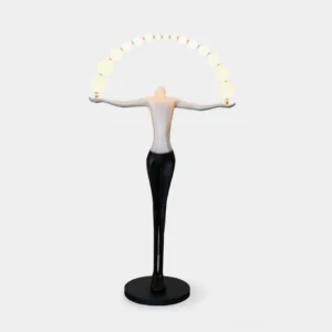 Liberty sculptural arc floor lamp with integrated LED globe lights, front view against studio white background, gradient black-to-white body with circular base