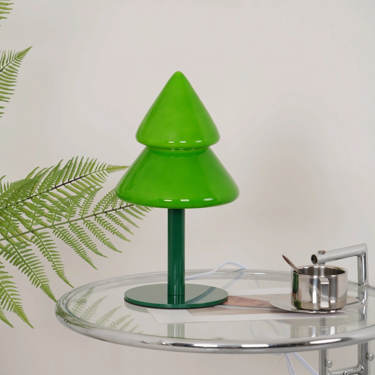 Visual lifestyle photography of modern Christmas tree table lamp in authentic home setting