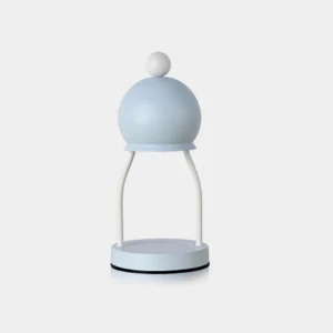 Modern minimalist dome candle warmer lamp with light blue finish on white background, front view