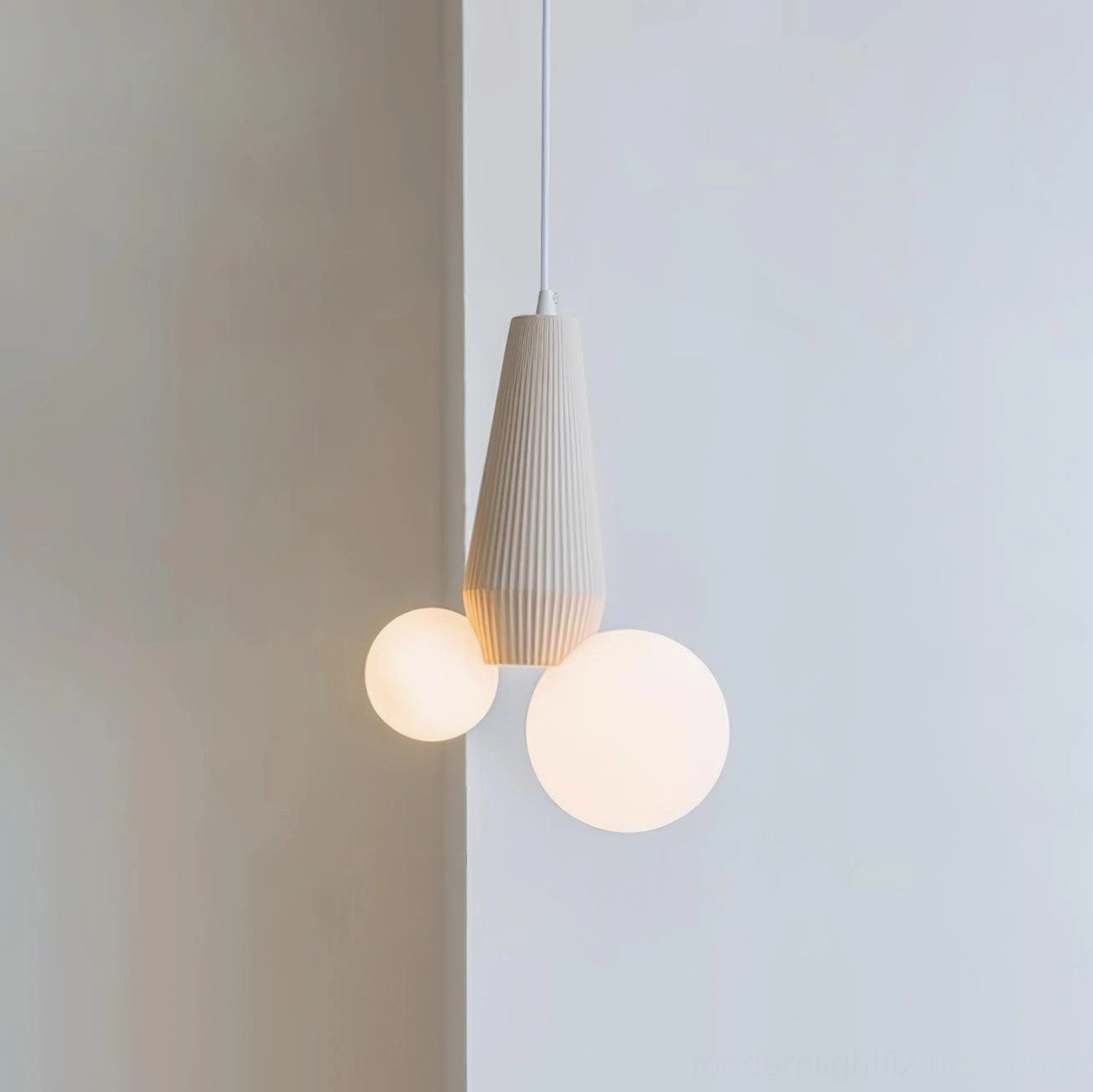 Light brown modern pendant light with dual frosted white glass shades - studio product photography