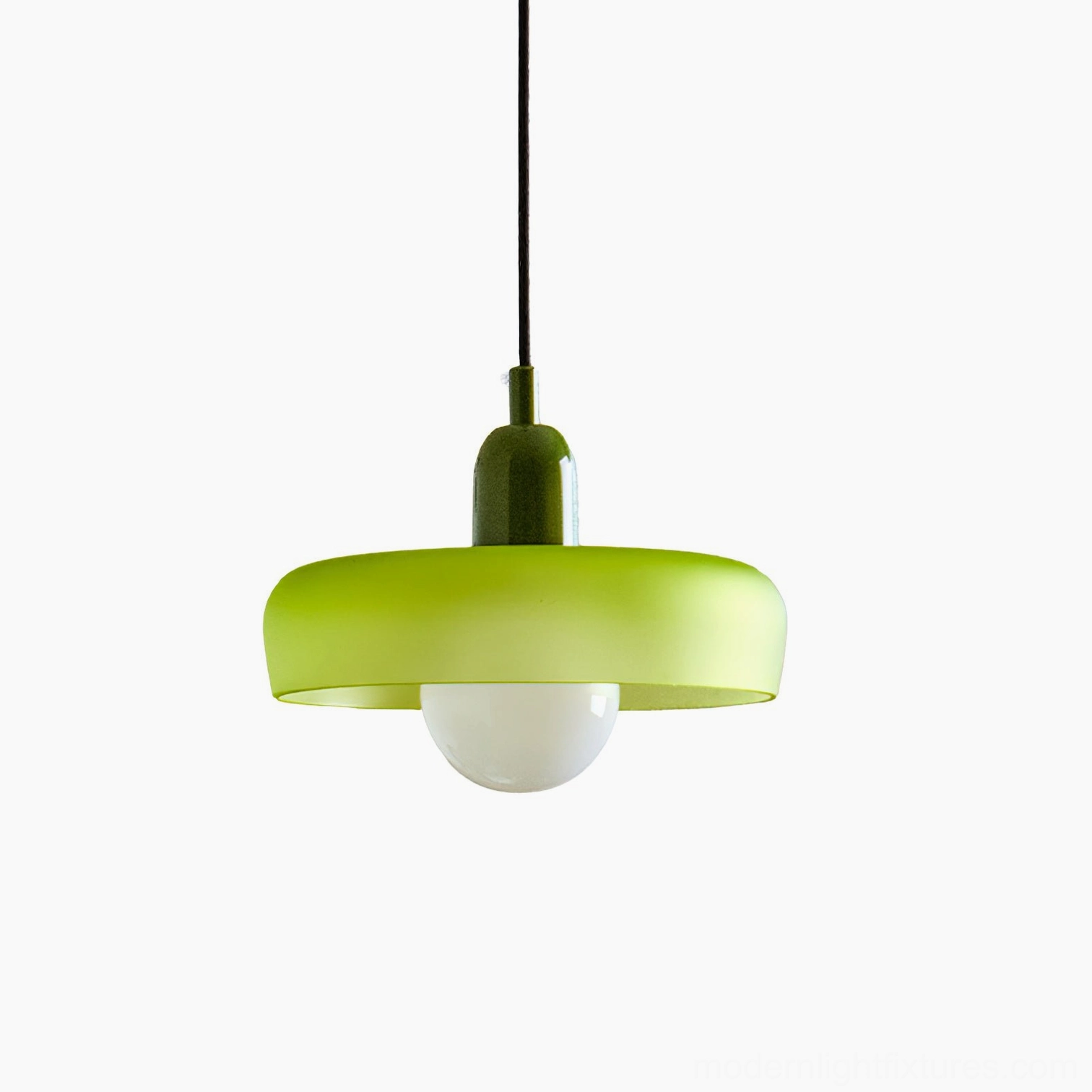 Light green frosted glass donut pendant light studio close-up with dark green holder, frontal view showing fresh color and modern geometric form