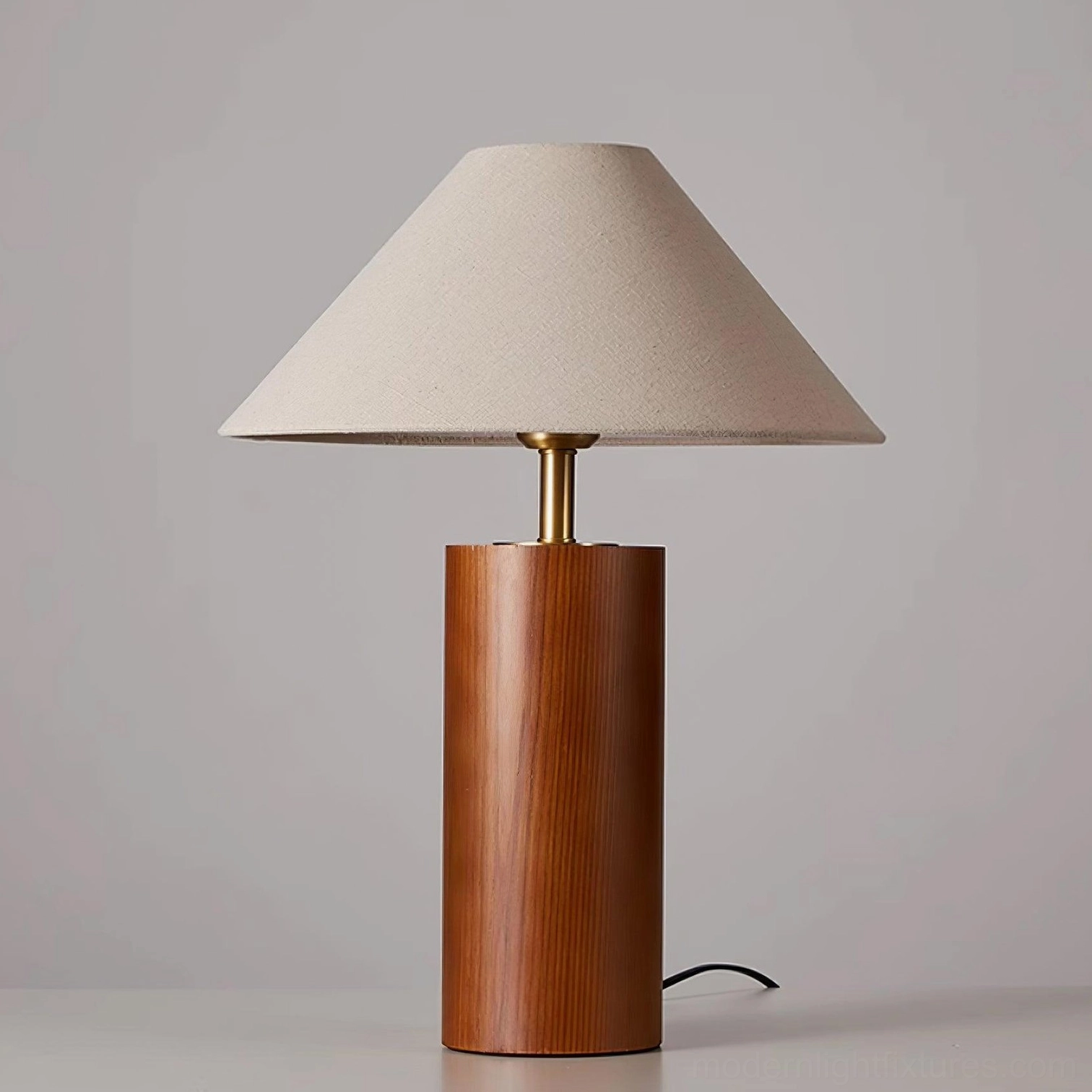 Light natural wood table lamp on furniture surface showing warm honey-toned finish