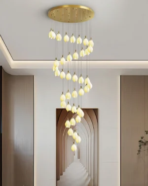 Lilium drop pendant chandelier installed in contemporary hallway, warm ambient lighting from frosted ceramic shades