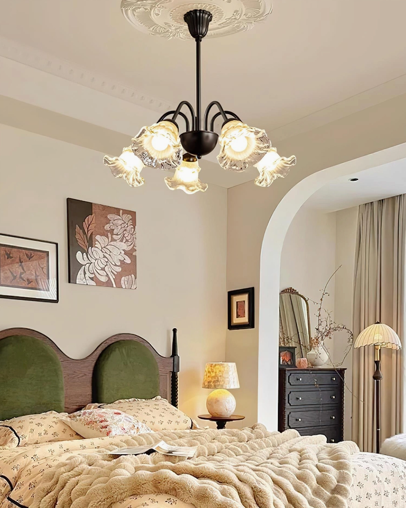 Lilura botanical flower chandelier installed in French-style bedroom with warm accent lighting